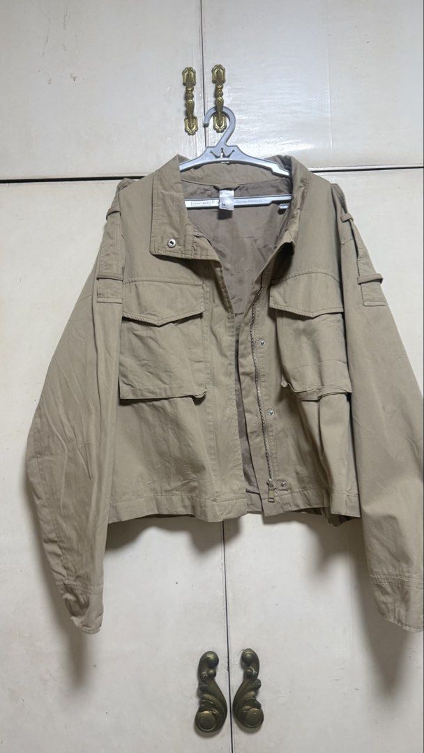 Khaki Utility Jacket Size 14 (Category: Coats, Jackets and Outerwear) located in Makati City. Submitted by mbcab (Listing ID 1469684992, Image 1). Description: - Brand: Anko - Size: 14 (Fits XL-XXXL) - Color: Khaki (Solid neutral) - Closure: Full zip with snap buttons - Details: Multiple front flap pockets, shoulder epaulets, smooth inner lining - Condition: Clean overall shape, perfect for everyday wear - Bought in Australia Aug26.