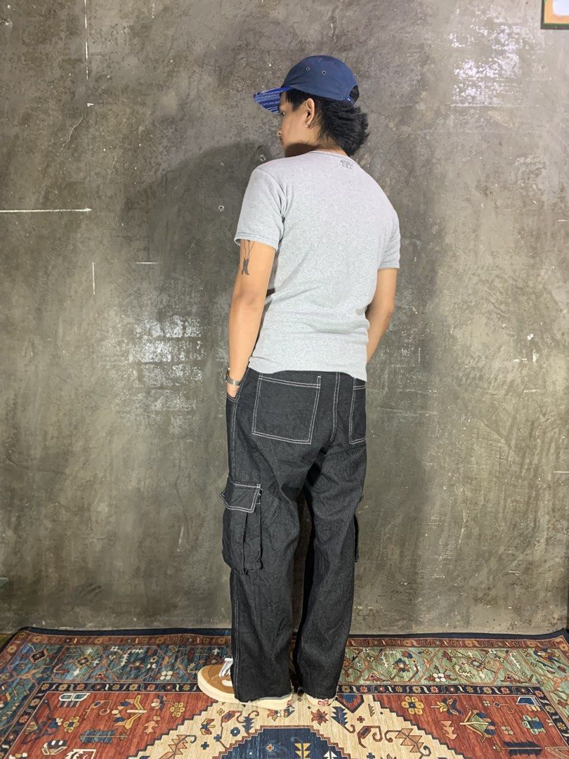 Kic City Conspirators Cargo Pants (Category: Jeans) located in Aurora. Submitted by cpr_garments13 (Listing ID 1469681805, Image 2). Description: Models height 5’6 •Waist:26-31 •Thigh:13 •Length:37 •Leg opening:8.5 Excellent condition -Altered Length.