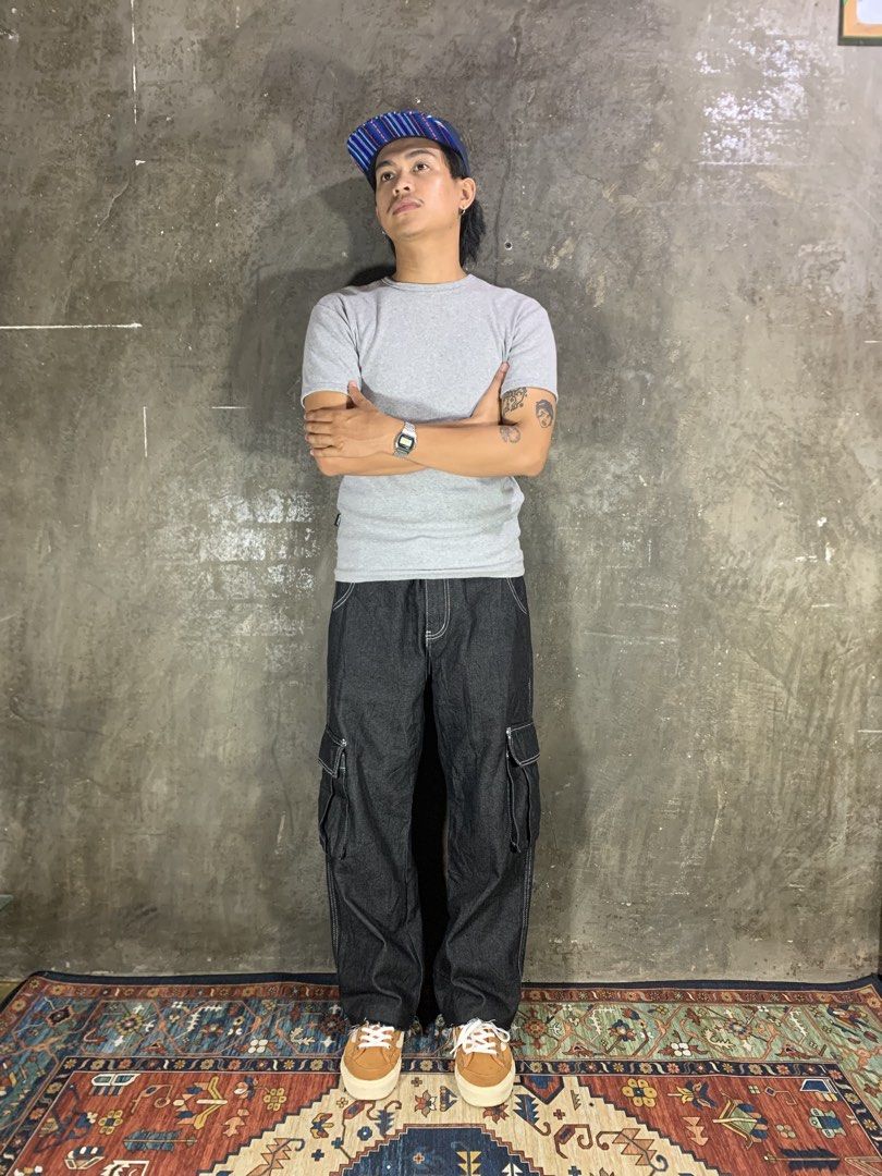 Kic City Conspirators Cargo Pants (Category: Jeans) located in Aurora. Submitted by cpr_garments13 (Listing ID 1469681805, Image 1). Description: Models height 5’6 •Waist:26-31 •Thigh:13 •Length:37 •Leg opening:8.5 Excellent condition -Altered Length.