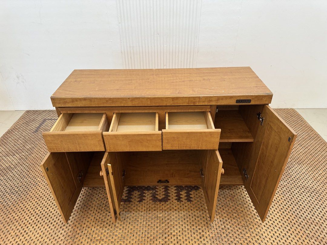Kitchen Counter (Category: Shelves, Cabinets & Racks) located in Quezon City. Submitted by matetdevis13 (Listing ID 1469602068, Image 3). Description: Wooden Kitchen Counter Cabinet with Pull-Out Worktop & Built-In Outlet Price: 9,500 L47 x W16.5 x H30.5 In good condition Code JMD28-M74 It has 3 drawers, multiple cabinet compartments, adjustable/storage shelves, a pull-out work surface, and a built-in electrical outlet, making it suitable as a ki
