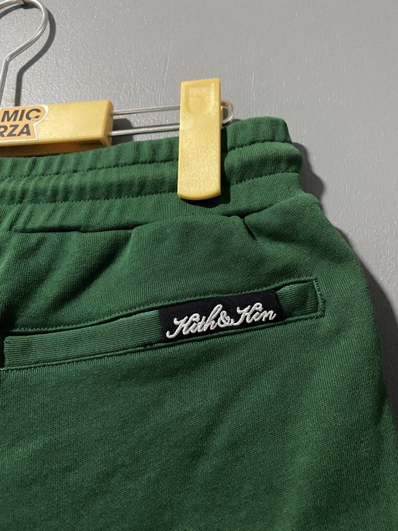 Kith & Kin Green Sweatshorts Size M (Category: Shorts) located in Tanay. Submitted by judevalcorza (Listing ID 1469706688, Image 3). Description: - Brand: Kith And Kin - Item: Green Sweatshorts - Size: Medium Waist 30/32 Length 17 - Material: 100% Cotton - Features: Elastic waistband with drawstring closure, stylish scalloped curved hem design - Details: Back pocket with 'Kith & Kin' embroidered logo patch - Condition: Excellent / As good as new.
