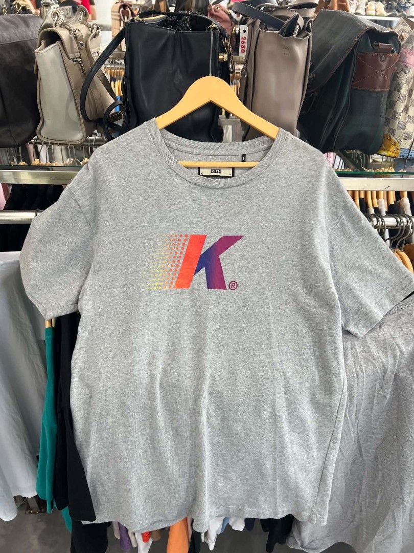 Kith Grey Gradient Logo T-Shirt Size S (Category: Tshirts & Polo Shirts ) located in Urdaneta. Submitted by jayceegarage (Listing ID 1469673645, Image 1). Description: - Brand: Kith - Color: Grey - Size: Small - Material: 100% Cotton (Self and Rib) - Design: Classic crew neck with a vibrant gradient logo graphic on the chest - Origin: Designed in NY / Assembled in China - Condition: Excellent, well-maintained - Mode of Payment: GCash, BPI, or Ban