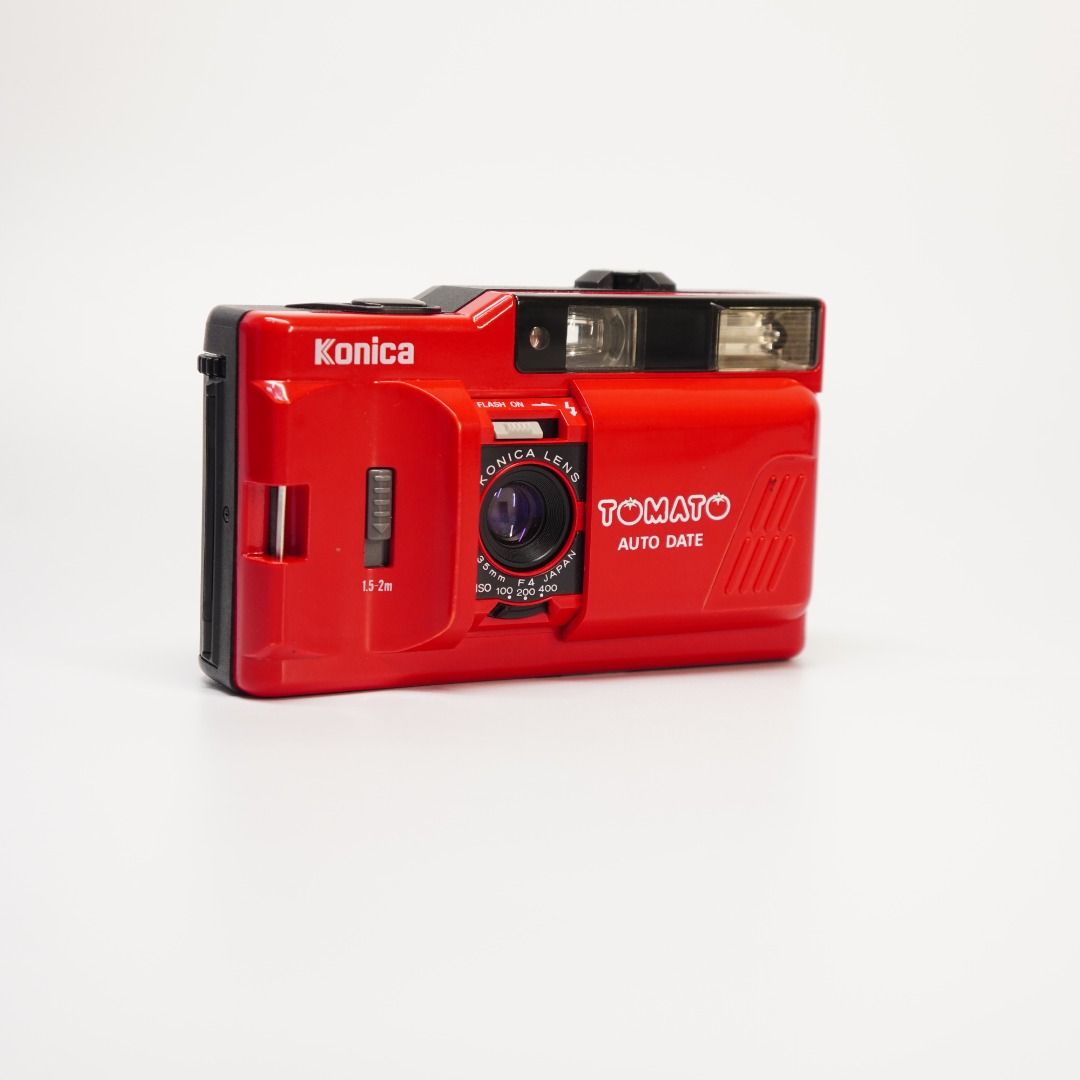 KONICA TOMATO AUTO DATE 🍅 | 35MM FILM CAMERA (Category: Cameras) located in Las Pinas. Submitted by retrocameraph (Listing ID 1469711263, Image 3). Description: KONICA TOMATO AUTO DATE 🍅 | 35MM FILM CAMERA A little red classic for everyday film photography! ❤️📸 The Konica Tomato Auto Date keeps things simple with its compact design, easy-to-use lens cover, and built-in flash. Why You’ll Love It 📷 35mm f/4 Konica lens 🎞️ Shoots standard 35mm 
