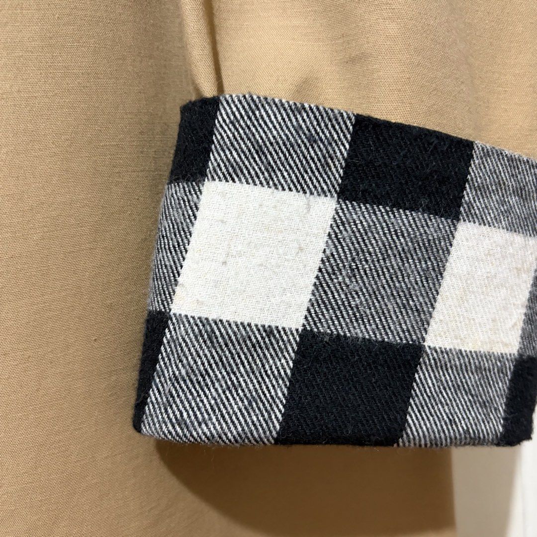 Korea Trench Coat Khaki Checkered Cuffs (Category: Coats, Jackets and Outerwear) located in Quezon City. Submitted by tflquezoncity (Listing ID 1469729488, Image 3). Description: ❤️ LOVEV-DOVEY, Designed in Korea ❤️ Size 8, fits S-M ❤️ Khaki trench coat with clean minimalist design ❤️ Round neckline, concealed front button closure, long sleeves with folded black and white checkered cuffs which can be rolled-up to reveal a stylish black and white 