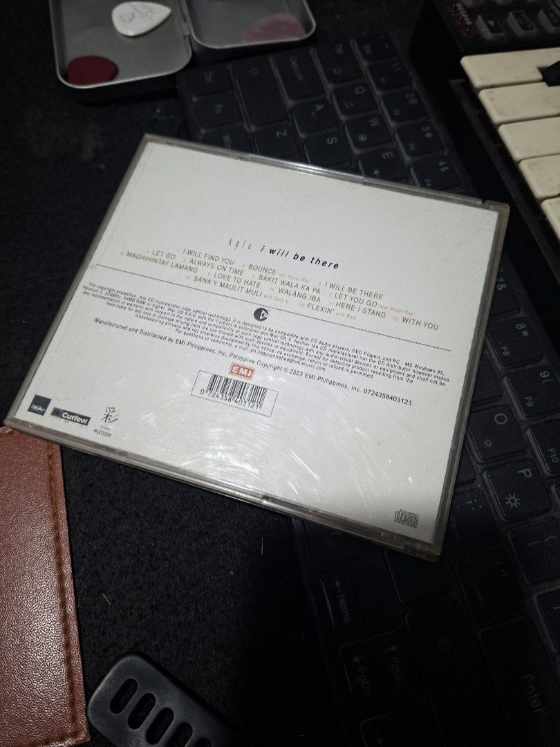 Kyla I Will Be There Audio CD Album (Category: CDs & DVDs) located in Manila. Submitted by djonathannagtalon-55936 (Listing ID 1469581076, Image 2). Description: Original Kyla audio CD titled I Will Be There, released in 2004 by EMI Philippines. Includes 15 tracks such as Someone To Love, Human Nature, and Because Of You. Standard jewel case packaging with front cover artwork and complete tracklist on the back. Case shows some light surface scrat
