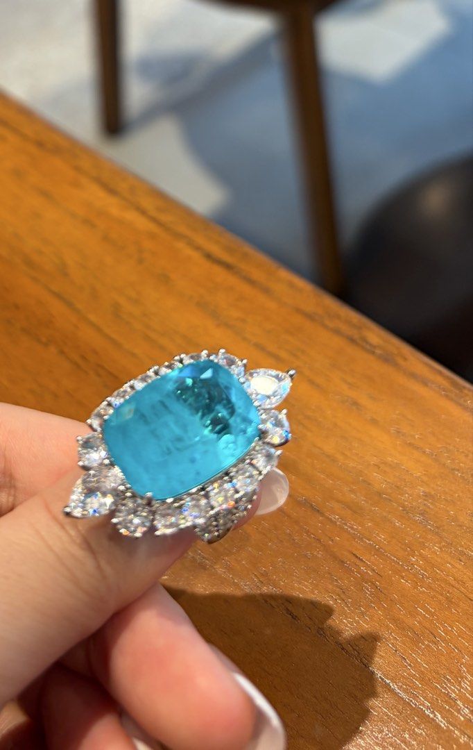 Lab/man made paraiba high quality random material and adjustable freesize ring (Category: Rings) located in Taguig. Submitted by labellearmoire2 (Listing ID 1469655149, Image 1). Description: High quality Lab/man made paraiba doublet random material and adjustable freesize ring Extremely big! Great as power/cocktail ring! Pls treat them as accessories as the exact material of the ring is unknown the lab made part was just what i was told when i b