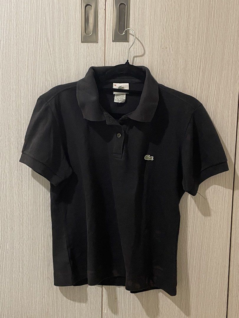 Lacoste Black Polo Shirt (Category: Tshirts & Polo Shirts ) located in Marikina City. Submitted by _dailydoseofclothing (Listing ID 1469709443, Image 1). Description: - Brand: Lacoste - Color: Classic Black - Material: Soft, breathable cotton - Design: Short sleeves, standard collar, button placket - Branding: Iconic embroidered green crocodile logo on chest - Style: Versatile everyday wear, easy to dress up or down - Issue: stain on the lower ba