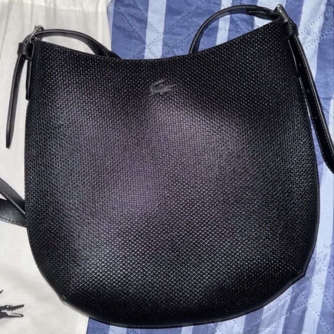LACOSTE Chantaco Crossbody Bag (Category: Shoulder Bags) located in Paranaque City. Submitted by beamiral (Listing ID 1469726586, Image 2). Description: RFS: Was not able to use this ever and sayang naman since super bago pa. • Bought this for P11,950 • This was purchased at Lacoste Glorietta. • No scratches. Never been used. • Comes with the original dust bag • Enclosed with a magnetic button • Has a lot of pockets inside and out.