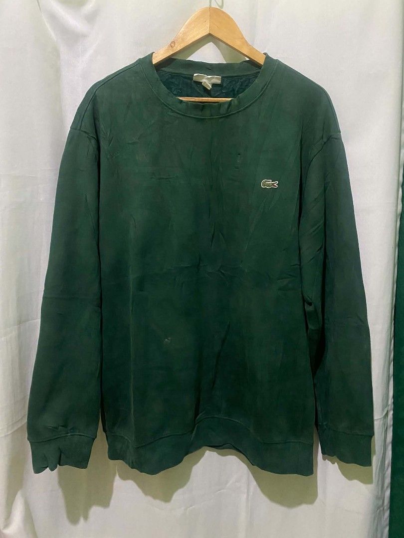 Lacoste Men's Dark Green Long Sleeve Crewneck Sweatshirt (Category: Coats, Jackets and Outerwear) located in Quezon City. Submitted by elihur.tuazon (Listing ID 1469683075, Image 2). Description: - Brand: Lacoste - Color: Dark green - Style: Crewneck sweatshirt with long sleeves - Details: Classic embroidered crocodile logo patch on the left chest - Comfort: Soft textured lining inside the collar, ribbed cuffs, and hem - Condition: Great for ever