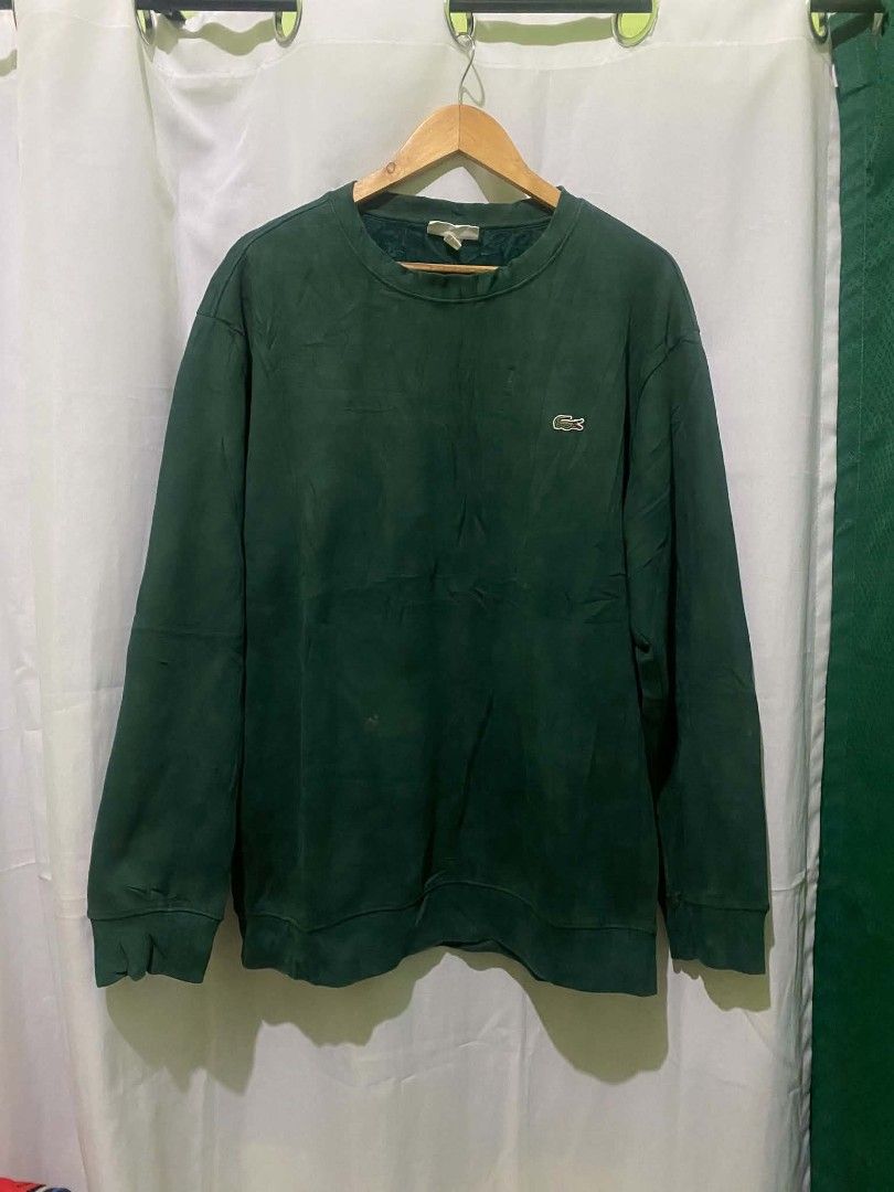 Lacoste Men's Dark Green Long Sleeve Crewneck Sweatshirt (Category: Coats, Jackets and Outerwear) located in Quezon City. Submitted by elihur.tuazon (Listing ID 1469683075, Image 1). Description: - Brand: Lacoste - Color: Dark green - Style: Crewneck sweatshirt with long sleeves - Details: Classic embroidered crocodile logo patch on the left chest - Comfort: Soft textured lining inside the collar, ribbed cuffs, and hem - Condition: Great for ever