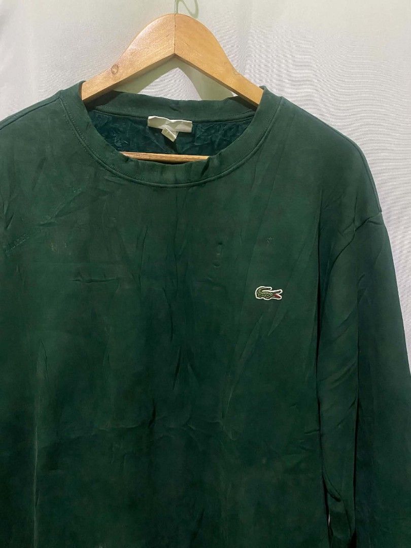 Lacoste Men's Dark Green Long Sleeve Crewneck Sweatshirt (Category: Coats, Jackets and Outerwear) located in Quezon City. Submitted by elihur.tuazon (Listing ID 1469683075, Image 3). Description: - Brand: Lacoste - Color: Dark green - Style: Crewneck sweatshirt with long sleeves - Details: Classic embroidered crocodile logo patch on the left chest - Comfort: Soft textured lining inside the collar, ribbed cuffs, and hem - Condition: Great for ever