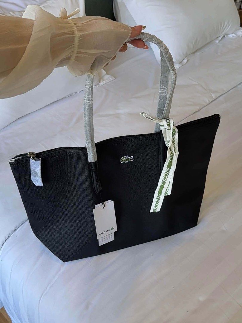 Lacoste Large Tote (Category: Tote Bags) located in Quezon City. Submitted by stuffs.hellyy (Listing ID 1469719110, Image 1). Description: actual photo posted .
