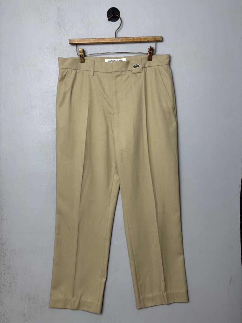 Lacoste Men's Khaki Chino Pants (Category: Chinos) located in Mandaluyong City. Submitted by fellas_ph (Listing ID 1469663309, Image 2). Description: Excellent condition No issues 32-34" Waistline 38" Length 12" Thigh 8" Opening/Hem.