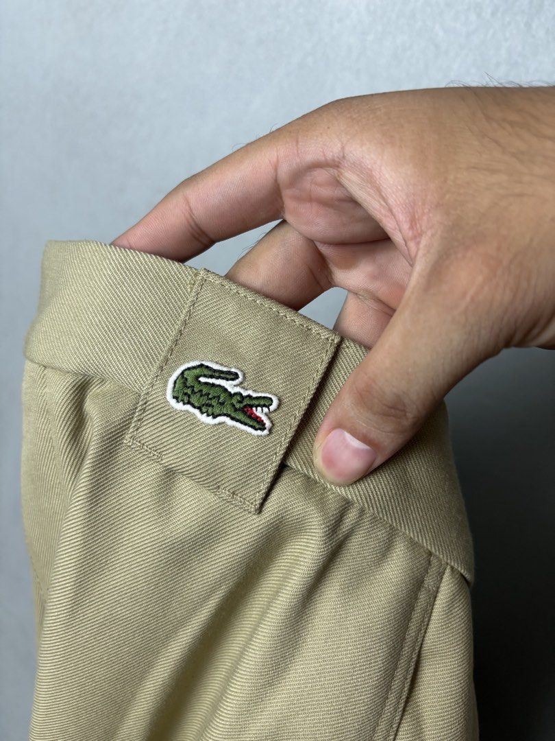 Lacoste Men's Khaki Chino Pants (Category: Chinos) located in Mandaluyong City. Submitted by fellas_ph (Listing ID 1469663309, Image 3). Description: Excellent condition No issues 32-34" Waistline 38" Length 12" Thigh 8" Opening/Hem.