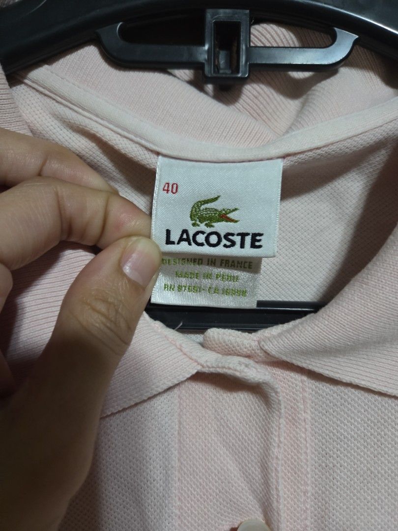 Lacoste Pink Polo Shirt Size 40 (Category: Tshirts & Polo Shirts ) located in Quezon City. Submitted by klarebear15 (Listing ID 1469729808, Image 3). Description: - Authentic Lacoste polo shirt in a versatile light pink shade - Size: Tagged size 40 - Design: Classic collar, short sleeves, and two-button placket.