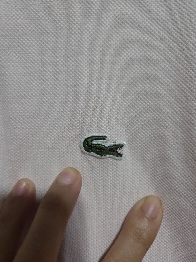 Lacoste Pink Polo Shirt Size 40 (Category: Tshirts & Polo Shirts ) located in Quezon City. Submitted by klarebear15 (Listing ID 1469729808, Image 2). Description: - Authentic Lacoste polo shirt in a versatile light pink shade - Size: Tagged size 40 - Design: Classic collar, short sleeves, and two-button placket.