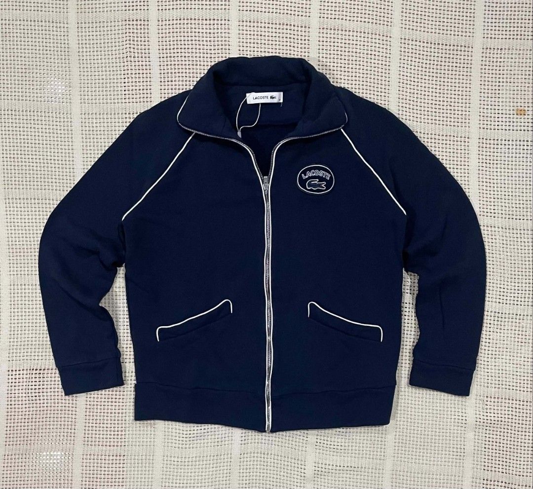 Lacoste Stand Up Collar Pipe Zippered Track Jacket (Category: Luxury Apparel) located in Bacolod City. Submitted by abkicks_apparel (Listing ID 1469727593, Image 1). Description: Lacoste Stand Up Collar Pipe Zippered Track Jacket Size 38 on Tag W19 L24 Authentic Original As New Condition No Hidden Issues .