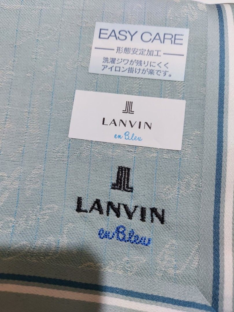 LANVIN en Bleu Green Handkerchief Pocket Square (Category: Handkerchief & Pocket Squares) located in Caloocan City. Submitted by chonadura91470 (Listing ID 1469650654, Image 3). Description: - Brand: Lanvin en Bleu - Color: Green with subtle patterned background - Condition: Brand new with tags attached - Material: Easy-care fabric - Design: Classic folded square style featuring embroidered designer logo text - Perfect for: Everyday pocket access