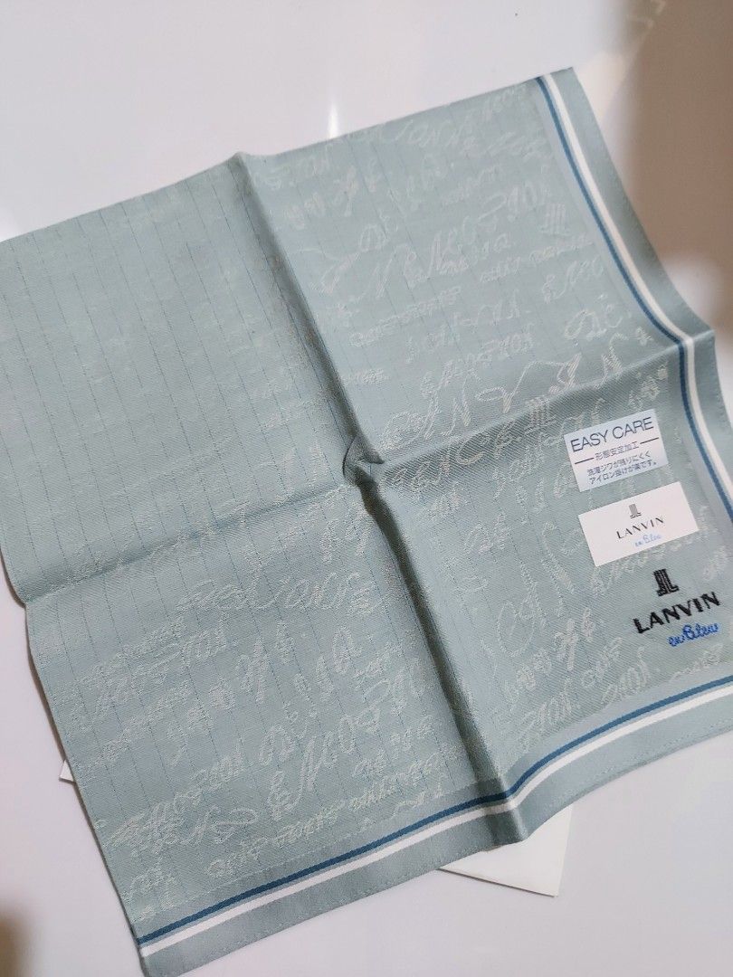 LANVIN en Bleu Green Handkerchief Pocket Square (Category: Handkerchief & Pocket Squares) located in Caloocan City. Submitted by chonadura91470 (Listing ID 1469650654, Image 2). Description: - Brand: Lanvin en Bleu - Color: Green with subtle patterned background - Condition: Brand new with tags attached - Material: Easy-care fabric - Design: Classic folded square style featuring embroidered designer logo text - Perfect for: Everyday pocket access