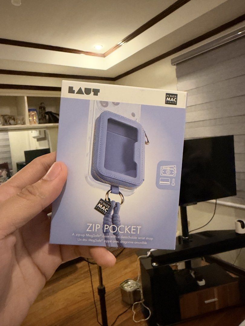 LAUT Zip Pocket MagSafe Case with Wrist Strap (Category: Cases & Sleeves) located in Manila. Submitted by supremeloved (Listing ID 1469646002, Image 1). Description: - Brand: LAUT Zip Pocket MagSafe Case - Color: Light Purple (Power Mac Center Special Edition) - Condition: Brand new, unopened box - Features: Clear design to show off your phone - Extras: Includes a handy zip pouch for cash/cards and a detachable wrist strap.