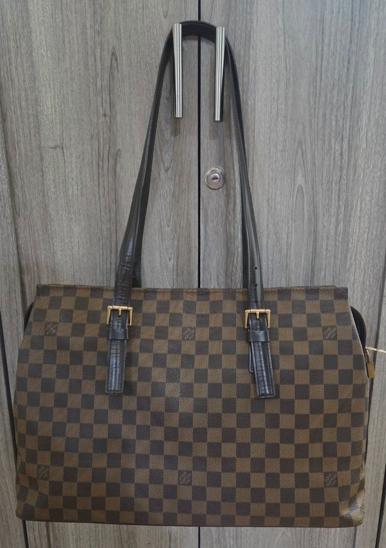 LV Chelsea Tote (Category: Luxury Bags & Wallets) located in Manila. Submitted by vra.luxe (Listing ID 1469701295, Image 2). Description: For Sale! 👜 Louis Vuitton Chelsea Damier Ebene ✨ Condition: Slightly Used — Rank AB to Near A 👜 Bag Description: Classic Louis Vuitton Chelsea in the timeless Damier Ebene canvas with dark brown leather trim, gold-tone hardware, and a spacious interior lined in red textile. Features a secure top zipper closur