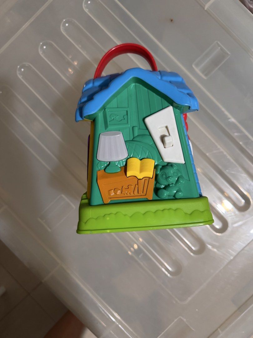 LeapFrog Learning Home interactive toy house (Category: Educational & Learning Toys) located in Manila. Submitted by chicmom.of.3 (Listing ID 1469711684, Image 2). Description: - Multi-sided LeapFrog interactive play house with different themed rooms - Includes living room with reading nook, bathroom with rubber duck, and kitchen with fridge and clock details - Built-in sound features with a front power button and sound toggle switch - Easy-to-ca