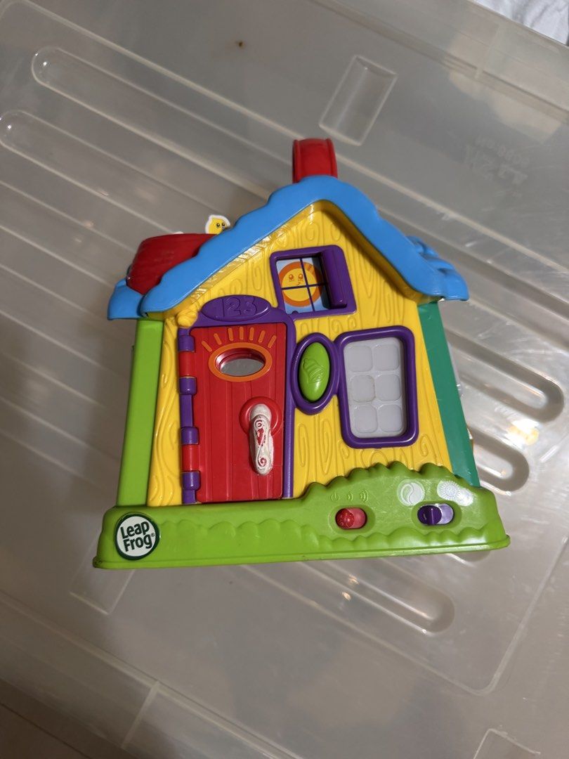 LeapFrog Learning Home interactive toy house (Category: Educational & Learning Toys) located in Manila. Submitted by chicmom.of.3 (Listing ID 1469711684, Image 1). Description: - Multi-sided LeapFrog interactive play house with different themed rooms - Includes living room with reading nook, bathroom with rubber duck, and kitchen with fridge and clock details - Built-in sound features with a front power button and sound toggle switch - Easy-to-ca