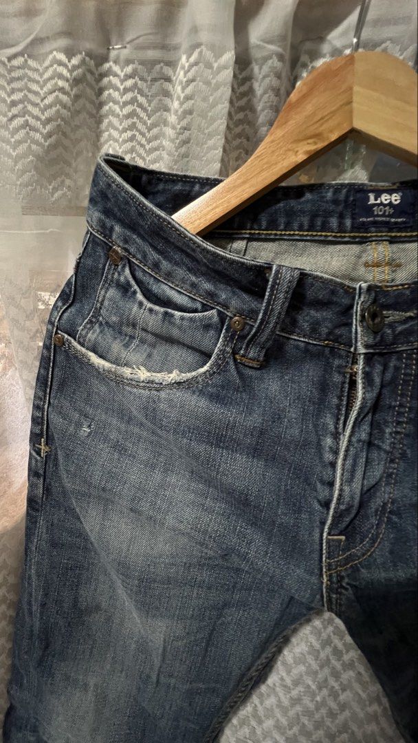 Lee 101+ Distressed Denim Jeans Dark Wash (Category: Jeans) located in Pasig City. Submitted by morilove (Listing ID 1469589095, Image 2). Description: - Brand/Model: Lee 101+ dark wash denim jeans - Fit: Slim fit with a rugged, worn-in aesthetic - Details: Heavy fading, whiskering, and distressed pocket edges - Hardware: Button fly closure with branded hardware - Classic Features: Lee leather back patch and iconic lazy S back pocket stitching - 