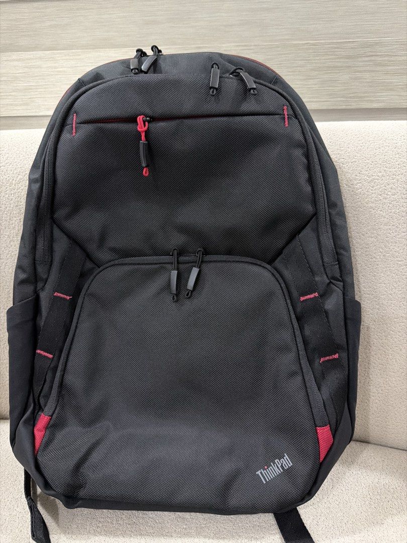 Lenovo ThinkPad Black Laptop Backpack (Category: Backpacks) located in Pasig City. Submitted by kzbcm2 (Listing ID 1469620215, Image 1). Description: - Authentic Lenovo ThinkPad black laptop backpack - Multiple zipped compartments and inner mesh pockets for easy organization - Padded back panel and shoulder straps for all-day comfort - Heavy-duty molded top handle for extra durability - Stylish signature red stitching and zipper pulls - Clean int