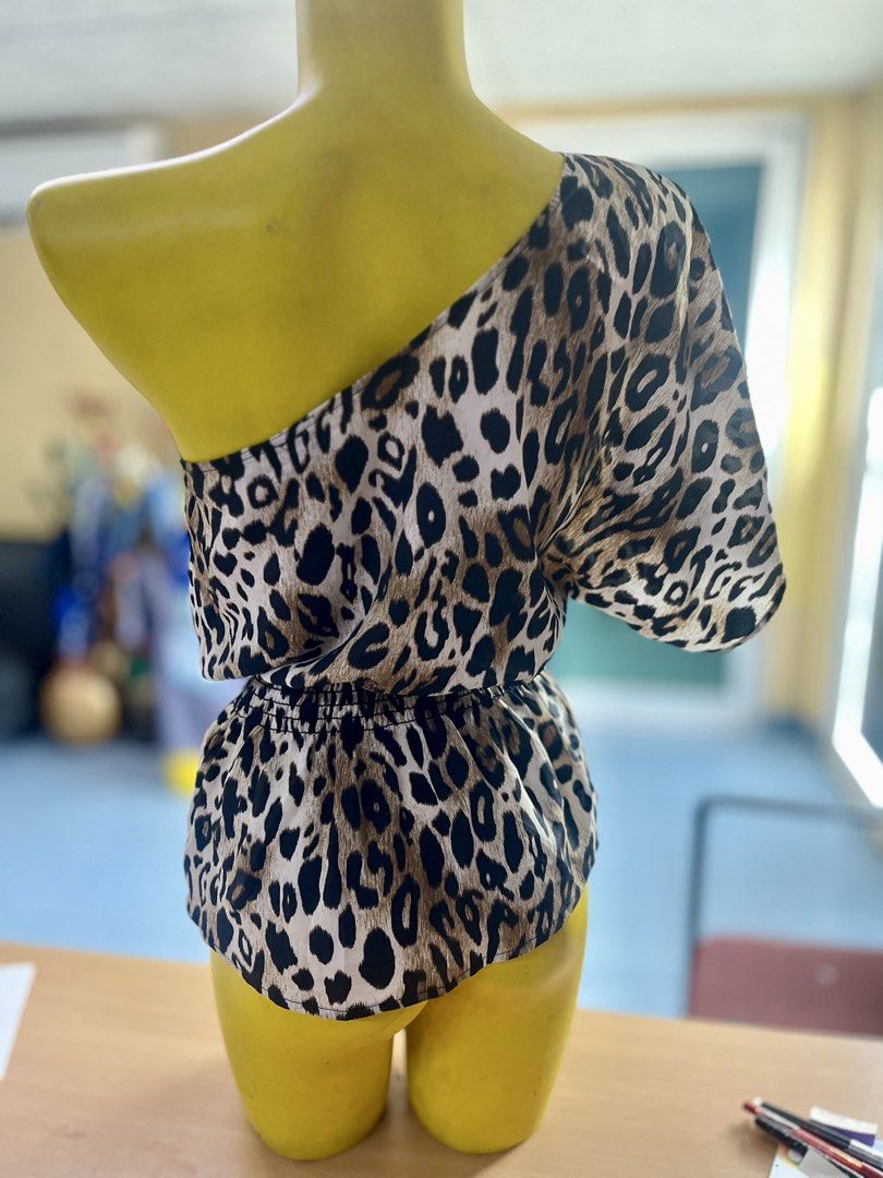 Leopard Print One-Shoulder Blouse WB (Category: Blouses) located in Mandaue City. Submitted by isabelle915 (Listing ID 1469588603, Image 3). Description: - Trendy one-shoulder neckline with half sleeve - Chic leopard print pattern - Elasticated waist for a flattering peplum silhouette - Lightweight and smooth fabric - Perfect for parties and casual night outs.