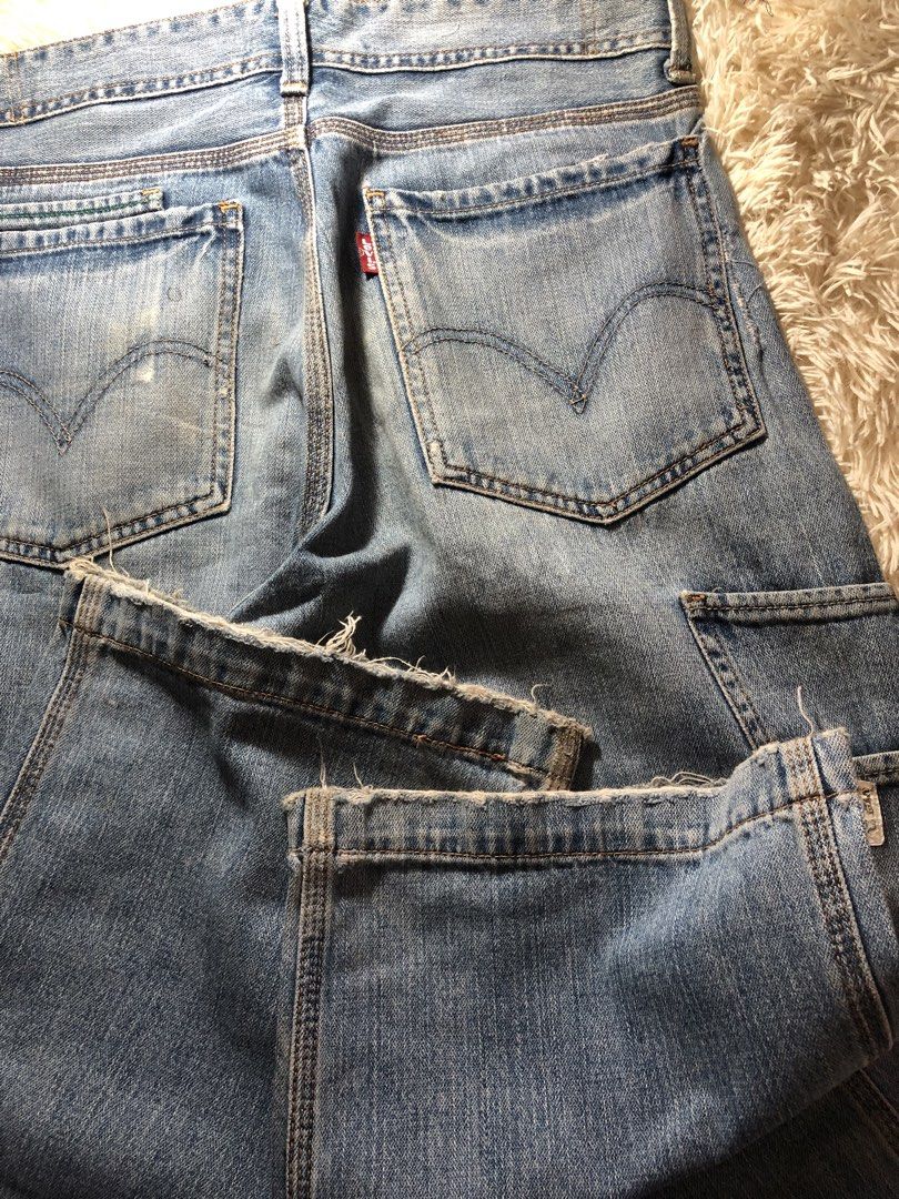 Levi's Carpenter Jeans Light Wash Distressed Denim (Category: Jeans) located in Maria Aurora. Submitted by kylerikathriftshop101010 (Listing ID 1469709263, Image 3). Description: 28-32 41 length 10 hem some repairs(workwear condi) maganda bagsak - Brand: Levi's - Style: Light wash carpenter jeans with utility pockets and hammer loop - Details: Distressed left knee with repair stitching and trendy frayed hems - Branding: Classic red tab on back po