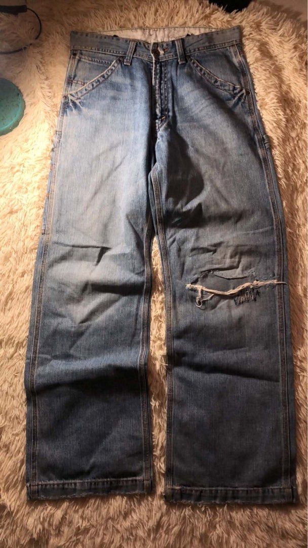 Levi's Carpenter Jeans Light Wash Distressed Denim (Category: Jeans) located in Maria Aurora. Submitted by kylerikathriftshop101010 (Listing ID 1469709263, Image 2). Description: 28-32 41 length 10 hem some repairs(workwear condi) maganda bagsak - Brand: Levi's - Style: Light wash carpenter jeans with utility pockets and hammer loop - Details: Distressed left knee with repair stitching and trendy frayed hems - Branding: Classic red tab on back po