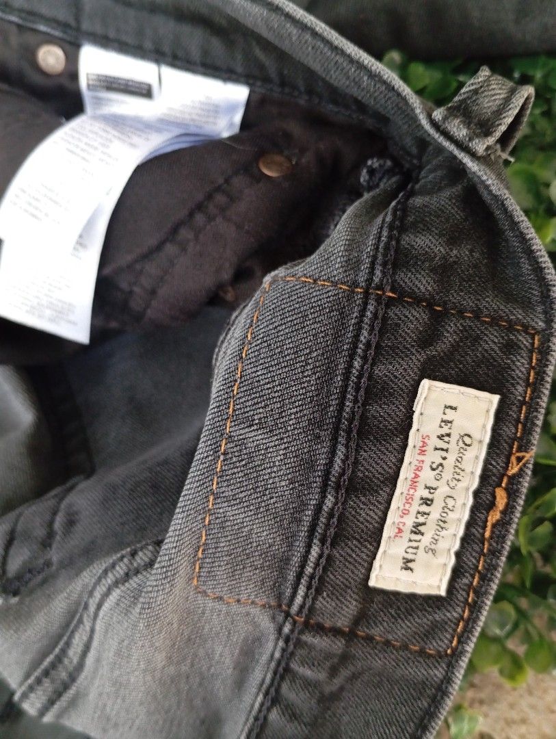 Levi's Premium Black Denim Jeans (Category: Jeans) located in Sariaya. Submitted by angelochintes732 (Listing ID 1469591757, Image 3). Description: - Brand: Levi's Premium Line - Color: Black denim with slight fading (regular wash) - Style: Classic five-pocket setup - Details: Contrast stitching, metal hardware, and signature leather back patch - Branding: Interior waist branding - Condition: Excellent / High-quality construction may issue na hol