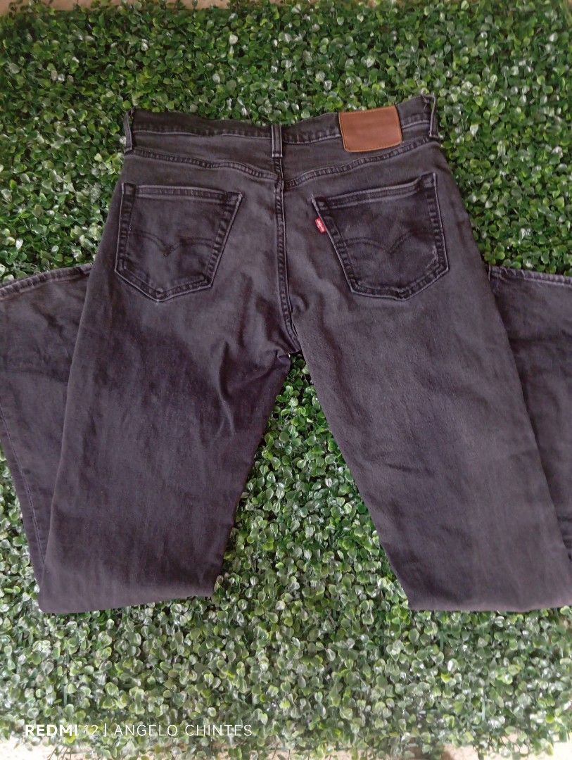 Levi's Premium Black Denim Jeans (Category: Jeans) located in Sariaya. Submitted by angelochintes732 (Listing ID 1469591757, Image 2). Description: - Brand: Levi's Premium Line - Color: Black denim with slight fading (regular wash) - Style: Classic five-pocket setup - Details: Contrast stitching, metal hardware, and signature leather back patch - Branding: Interior waist branding - Condition: Excellent / High-quality construction may issue na hol