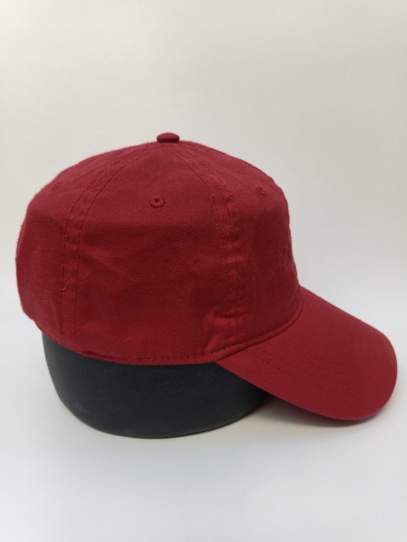 Levi's Red Cap (Category: Caps & Hats) located in Imus. Submitted by grindhouse.thriftshop (Listing ID 1469601648, Image 2). Description: - Brand: Levi's - Color: Bright red with white embroidered logo patch - Design: Classic 6-panel with curved brim and breathable eyelets - Fit: Adjustable strap at the back for a custom fit - Condition: Clean fabric, minimal wear, great for everyday casual use.