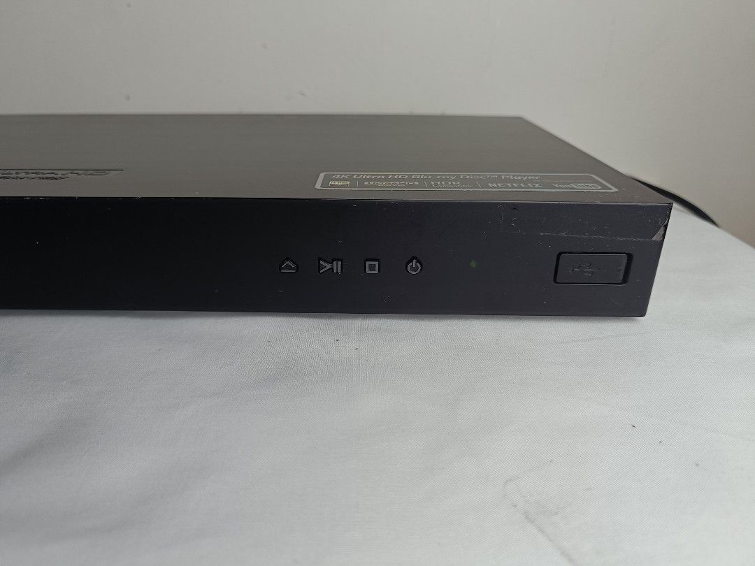 LG 4K Ultra HD Blu-ray Disc Player (Category: Blu-Ray & Media Players) located in Baguio. Submitted by clothes.over.bros.ph_2020 (Listing ID 1469692403, Image 3). Description: - Brand: LG 4K Ultra HD Blu-ray Player - Color: Sleek black - Playback: Supports 4K Ultra HD discs and regular DVDs with stunning HDR - Smart Features: Built-in access to Netflix and YouTube - Front Panel: Smooth-gliding disc tray, power/play/stop/eject buttons, and a conve