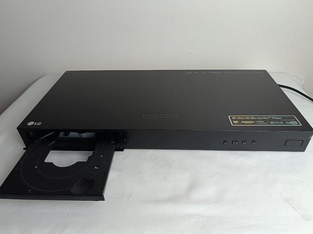 LG 4K Ultra HD Blu-ray Disc Player (Category: Blu-Ray & Media Players) located in Baguio. Submitted by clothes.over.bros.ph_2020 (Listing ID 1469692403, Image 1). Description: - Brand: LG 4K Ultra HD Blu-ray Player - Color: Sleek black - Playback: Supports 4K Ultra HD discs and regular DVDs with stunning HDR - Smart Features: Built-in access to Netflix and YouTube - Front Panel: Smooth-gliding disc tray, power/play/stop/eject buttons, and a conve