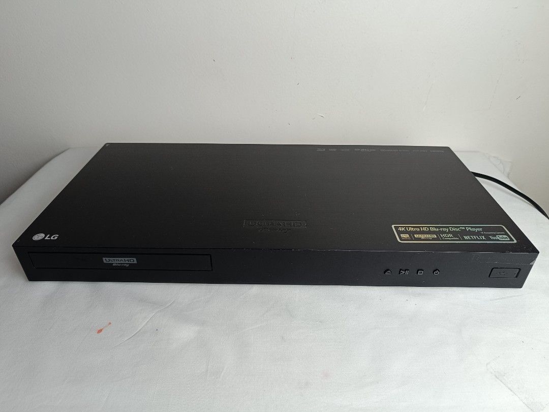 LG 4K Ultra HD Blu-ray Disc Player (Category: Blu-Ray & Media Players) located in Baguio. Submitted by clothes.over.bros.ph_2020 (Listing ID 1469692403, Image 2). Description: - Brand: LG 4K Ultra HD Blu-ray Player - Color: Sleek black - Playback: Supports 4K Ultra HD discs and regular DVDs with stunning HDR - Smart Features: Built-in access to Netflix and YouTube - Front Panel: Smooth-gliding disc tray, power/play/stop/eject buttons, and a conve