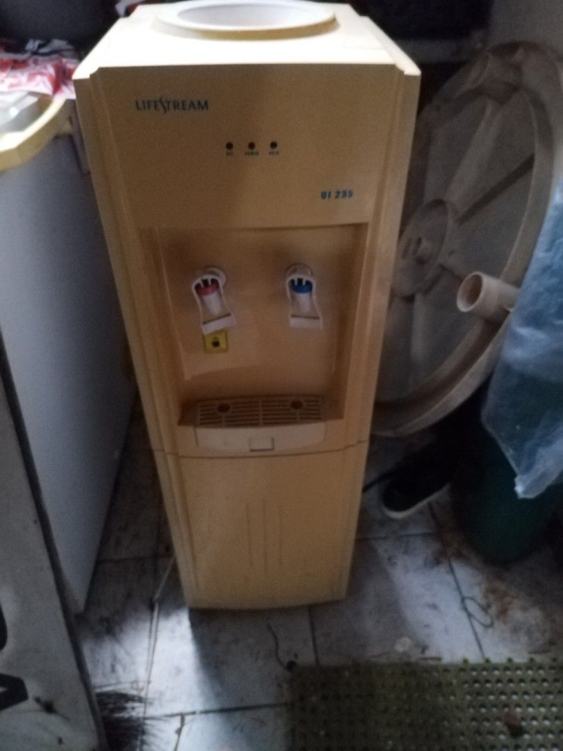 Lifestream UI 235 Standing Water Dispenser (Category: Water Purifiers & Dispensers) located in Makati City. Submitted by nerydevera (Listing ID 1469756593, Image 3). Description: - Brand/Model: Lifestream UI 235 floor-standing water dispenser - Color: Bright yellow and white exterior - Water Options: Dual taps for hot and cold water - Loading Type: Standard top-loading design for water jugs - Features: Removable front drip tray and power indicato