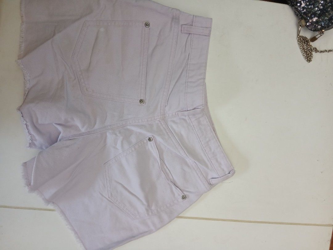 Light Purple Denim Shorts Raw Hem (Category: Shorts) located in Cainta. Submitted by chickennuggirl (Listing ID 1469580277, Image 2). Description: - Color: Pastel lilac / soft purple - Style: Mid-rise denim shorts with raw frayed hems - Details: Classic five-pocket design, silver metal button closure, and rivets - Features: Includes belt loops, great for warm weather outfits - Mode of Payment: GCash.