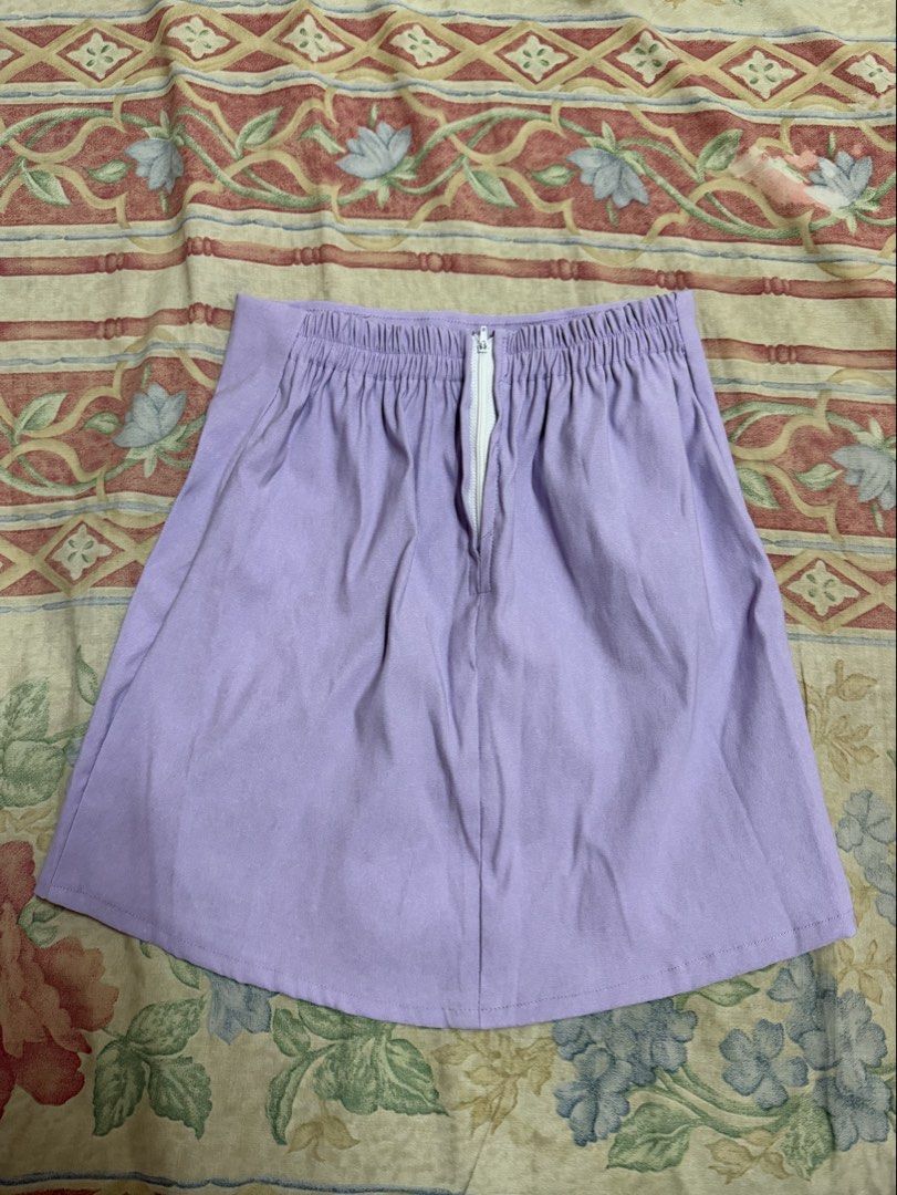 Lilac Mini Skirt (Category: Skirts) located in Manila. Submitted by tltdeclutters (Listing ID 1469739575, Image 2). Description: - A-line mini skirt with a side slit near the hem and zipper on the back - Garterized, free size - Can do same day delivery.