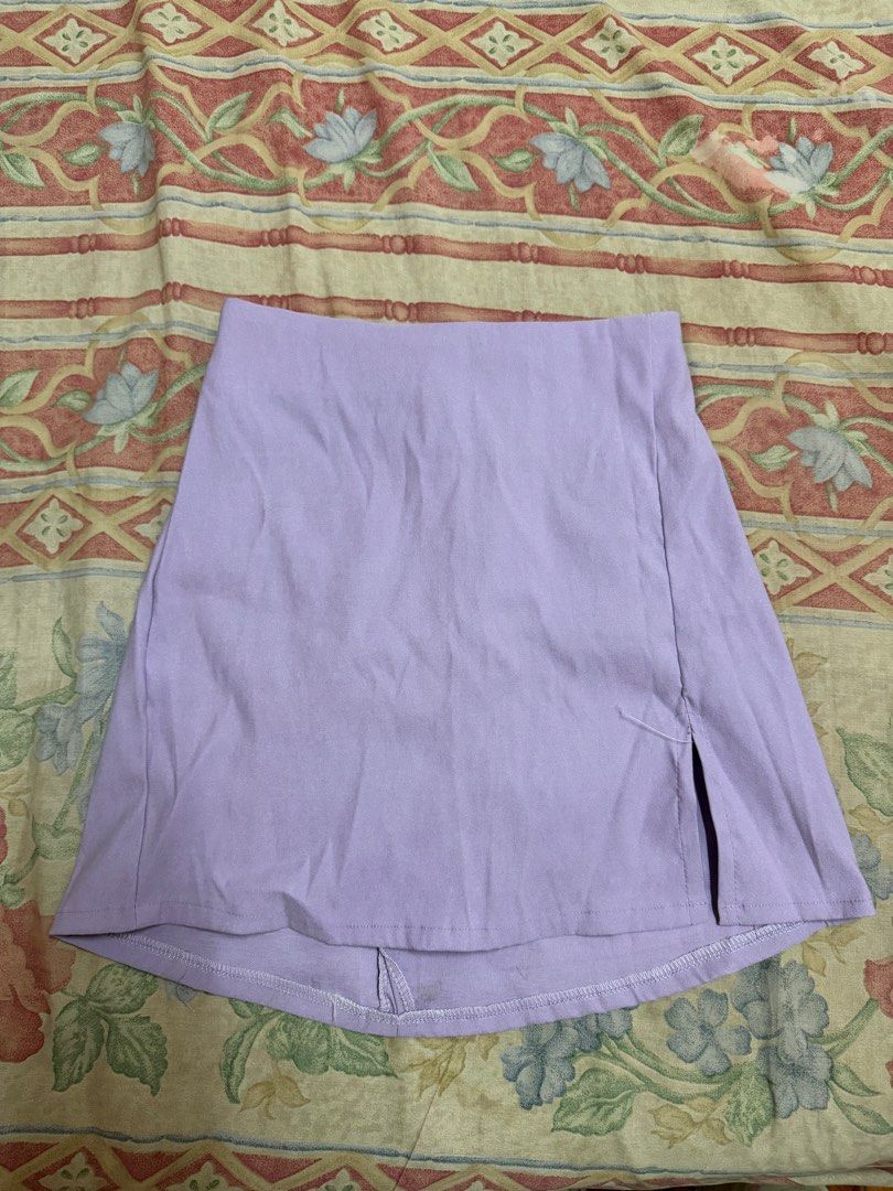 Lilac Mini Skirt (Category: Skirts) located in Manila. Submitted by tltdeclutters (Listing ID 1469739575, Image 1). Description: - A-line mini skirt with a side slit near the hem and zipper on the back - Garterized, free size - Can do same day delivery.