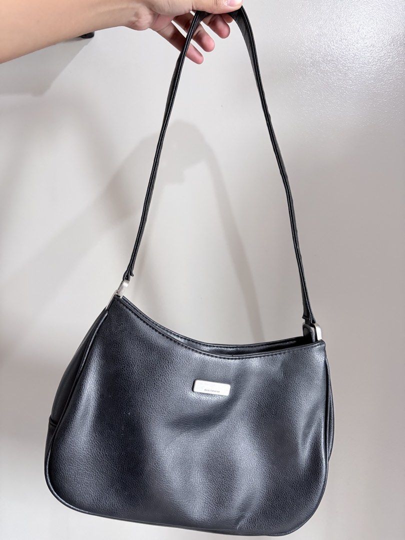 Liz Claiborne Black Shoulder Bag (Category: Shoulder Bags) located in Quezon City. Submitted by angelajuliet__ (Listing ID 1469591051, Image 2). Description: - Brand: Liz Claiborne - Color: Classic Black - Material: Pebbled faux leather with silver-tone hardware and front logo plaque - Style: Hobo shoulder bag with single strap - Closure: Secure zip top - Interior: Clean lining - Condition: Timeless vintage piece.