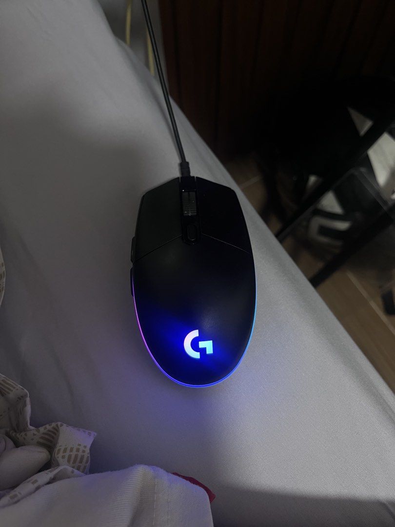 Logitech G102 Lightsync Wired Gaming Mouse (Category: Mouse & Mousepads) located in Naga. Submitted by raddeyy (Listing ID 1469664048, Image 2). Description: - Authentic Logitech wired gaming mouse in classic black - Reliable USB wired connection with neatly wrapped cable secured by a white strap - Features 2 convenient side buttons for thumb access - Has some scratches from use but not noticeable.