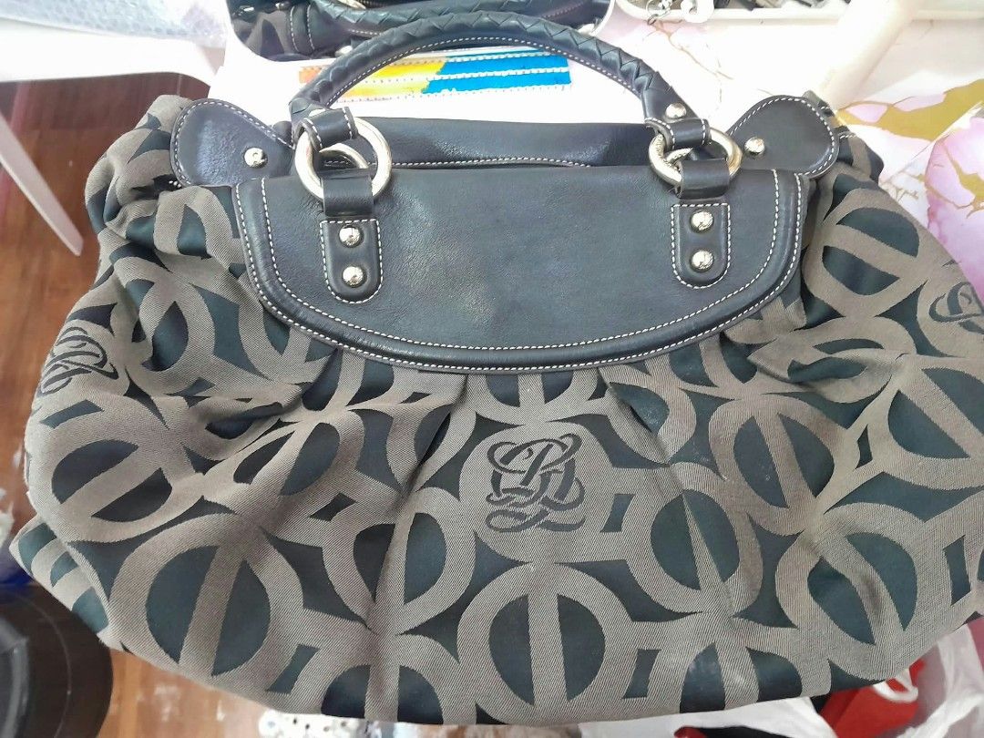 Louis Quatorze Monogram Handbag Black Brown (Category: Luxury Bags & Wallets) located in Manila. Submitted by royalwhale_636cf8 (Listing ID 1469594603, Image 2). Description: - Brand: Louis Quatorze - Design: Black and brown monogram fabric with black leather trim and silver-tone hardware - Handles & Strap: Stylish braided top handles plus a removable/adjustable shoulder strap - Closure & Interior: Secure top zipper closure with a branded brown l