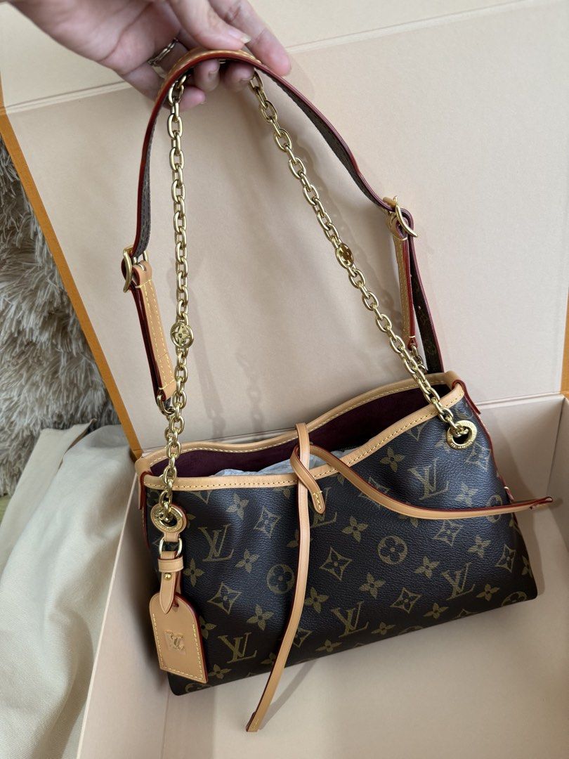 Louis Vuitton Carryall BB Monogram Shoulder Bag (Category: Luxury Bags & Wallets) located in Manila. Submitted by lunacakes (Listing ID 1469623380, Image 3). Description: - Brand: Louis Vuitton - Pattern: Monogram Canvas (Dark Brown) - Straps: Includes gold-tone chain strap and adjustable leather strap - Details: Natural cowhide leather trim with red edging and removable LV-stamped name tag - Interior: Burgundy lining - Condition: Brand new with 