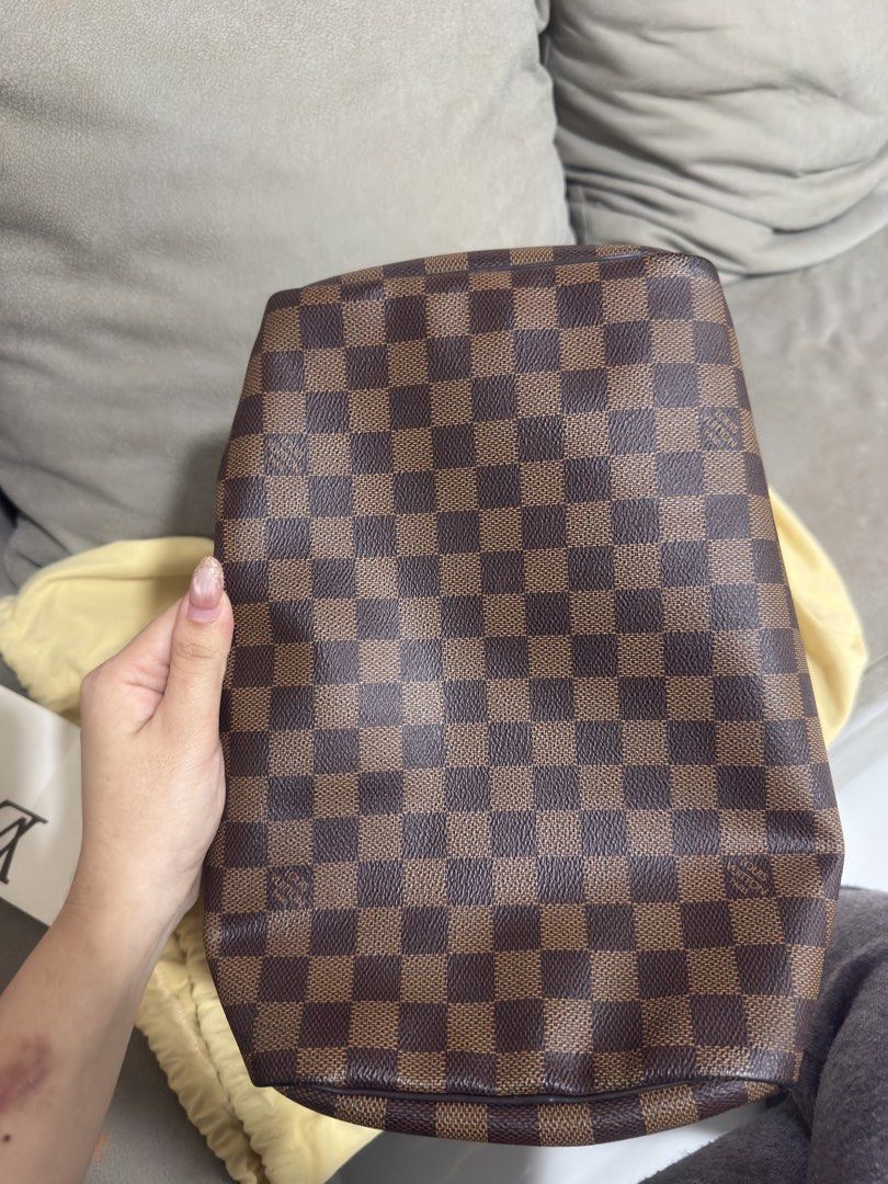 Louis Vuitton Damier Ebene Handbag (Category: Looking For) located in Caloocan City. Submitted by kimmndza_176 (Listing ID 1469662861, Image 2). Description: - Authentic Louis Vuitton Damier Ebene handbag in classic brown checkered canvas - Dual dark brown leather handles and elegant gold-tone hardware - Secure top zip closure with a structured, timeless shape - Includes original store receipt from Rome dated June 2017 - Comes with dust bag as se