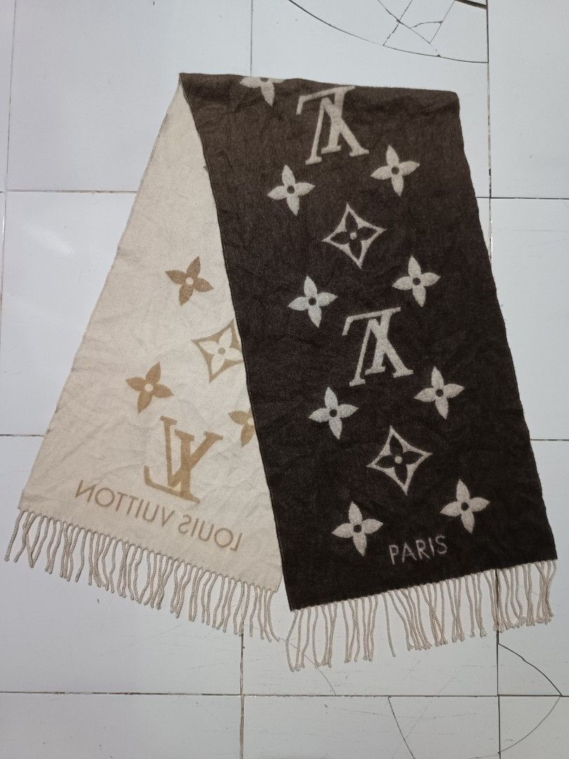Louis Vuitton Monogram Gradient Cashmere Scarf (Category: Scarves) located in Barotac Nuevo. Submitted by gray101 (Listing ID 1469698567, Image 2). Description: Luxurious Louis Vuitton cashmere scarf with signature monogram pattern and gradient brown-to-cream colorway. Fringe details along both ends. Includes woven blue brand tag displaying dry clean only instructions, 100% cashmere material composition, and made in United Kingdom origin. Soft te