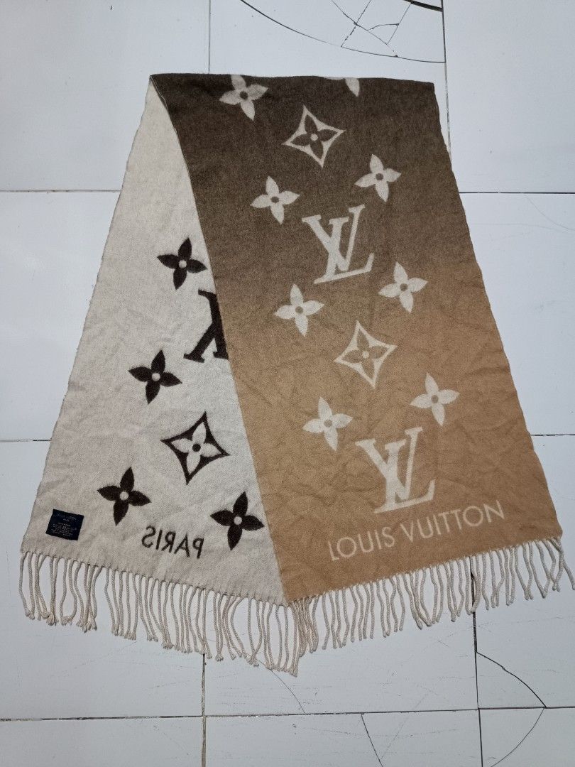 Louis Vuitton Monogram Gradient Cashmere Scarf (Category: Scarves) located in Barotac Nuevo. Submitted by gray101 (Listing ID 1469698567, Image 3). Description: Luxurious Louis Vuitton cashmere scarf with signature monogram pattern and gradient brown-to-cream colorway. Fringe details along both ends. Includes woven blue brand tag displaying dry clean only instructions, 100% cashmere material composition, and made in United Kingdom origin. Soft te