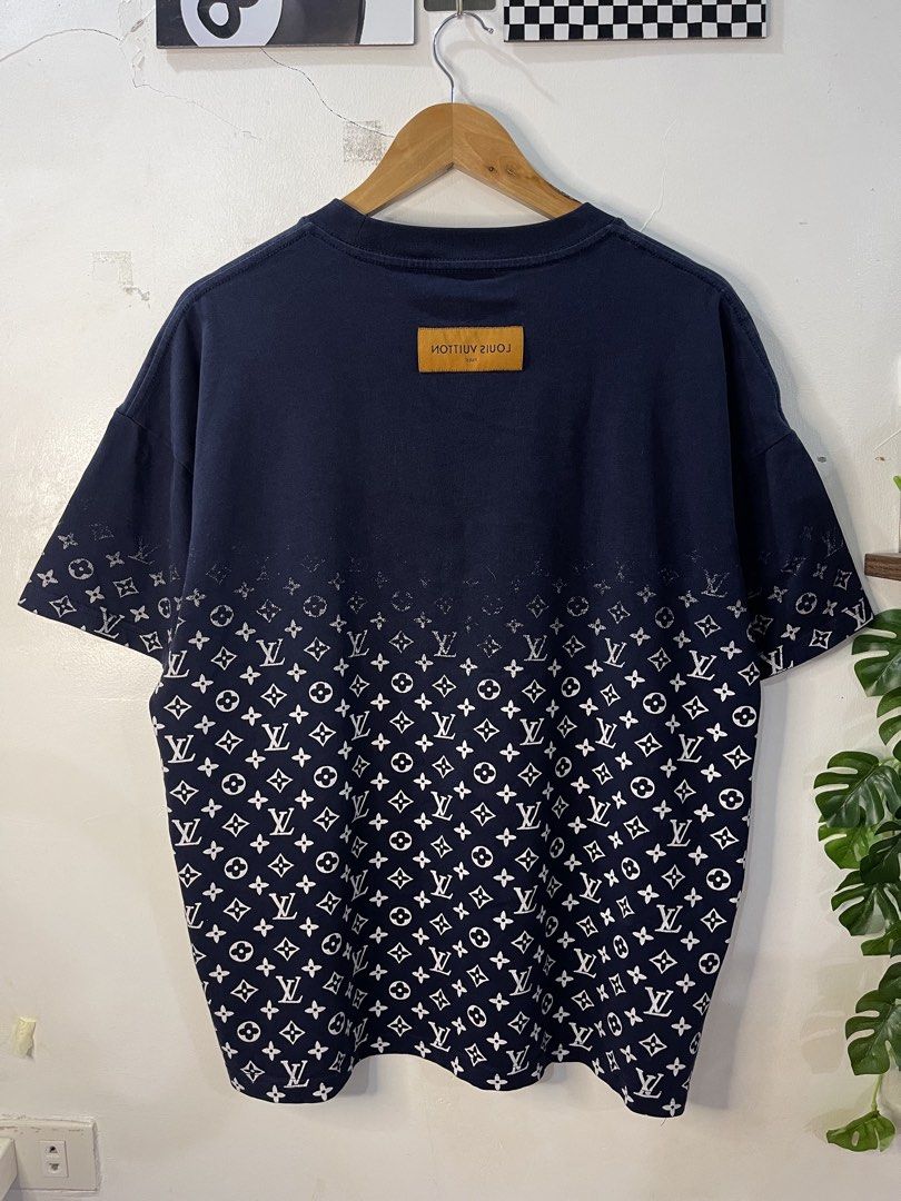 Louis Vuitton Monogram Gradient Navy Blue T-shirt (Category: Tshirts & Polo Shirts ) located in Cabagan. Submitted by blessingma81004 (Listing ID 1469740807, Image 3). Description: Louis Vuitton navy blue t-shirt made in Italy - Features a stylish gradient monogram print fading toward the top - Tagged Size M, fits like a Large (Actual measurements: Width 24" x Length 27") - Detailed with a branded collar tag and rear leather patch - Note: Minimal